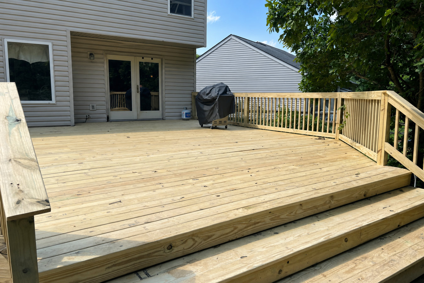 Pressure-treated wood deck construction